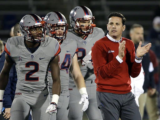 In this Nov. 4, 2016, file photo, then Connecticut coach Bob Diaco watches his players warm up for an NCAA college football game against Temple in East Hartford, Conn. Diaco has been named the new defensive coordinator at Nebraska. UConn fired Diaco last month after three straight losing seasons.