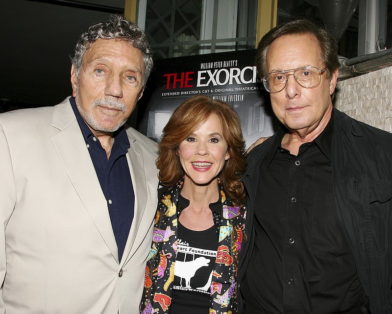In this Sept. 29, 2010 file photo released by Starpix, "The Exorcist" author William Peter Blatty, left, joins Linda Blair, who starred in the 1973 film and William Friedkin, the film's director, at a screening of the remastered film at the Museum of Modern Art in New York. Blatty died, Thursday, Jan. 12, 2017, at a hospital in Bethesda, Md, of multiple myeloma, a form of blood cancer, according to his wife Julie. He was 89. 