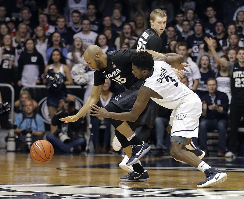 Butler's Kamar Baldwin (3) is fouled by Xavier's Myles Davis during the second half of an NCAA college basketball game, Saturday, Jan. 14, 2017, in Indianapolis. Butler defeated Xavier 83-78.