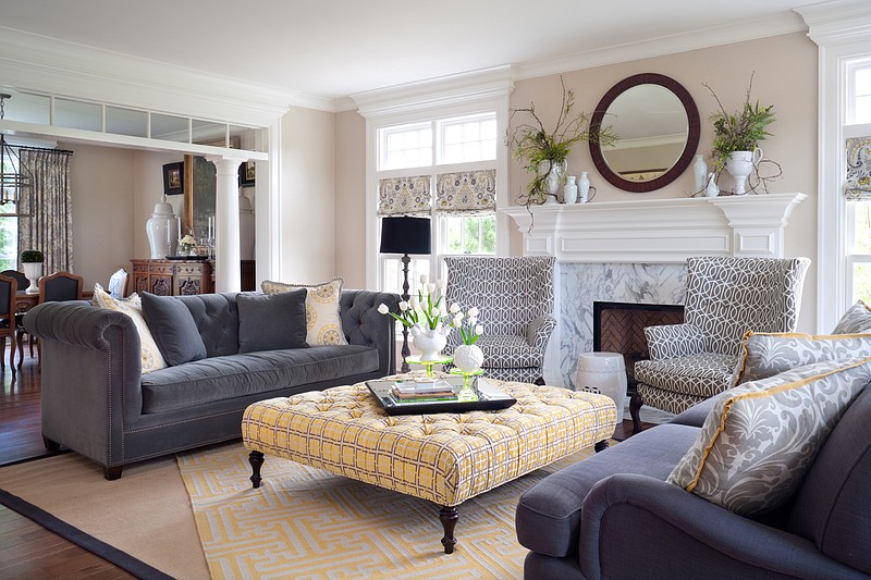 A Chesterfield paired with an English arm sofa.