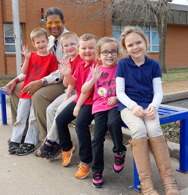 Kevin Browne, administrator of Kingdom Christian Academy, with some of his most huggable kindergarten students. He joined the team at the school in August 2016.