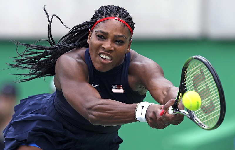 In this Sunday, Aug. 7, 2016 file photo, Serena Williams, of the United States, reaches for a return against Daria Gavrilova, of Australia, at the 2016 Summer Olympics in Rio de Janeiro, Brazil. Serena Williams left Australia last year as a beaten finalist, missing her chance to equal Steffi Graf's record for most Grand Slam singles titles in the Open era. Williams matched Graf's 22 by winning Wimbledon, and the six-time Australian Open champion returns to Melbourne Park aiming to secure the modern mark outright.