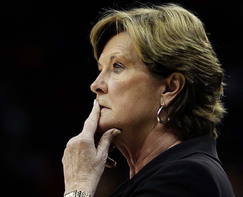 In this Nov. 12, 2010, file photo, Tennessee coach Pat Summitt watches her team against Louisville in an NCAA college basketball game in Louisville, Ky. For every home game during the fall 2016-17 basketball season, a chair of Tennessee's bench is left vacant to honor former coach Summitt, who died June 28, 2016. But the Lady Vols aren't the only team paying tribute to Summitt. Harvard, Vermont and Kentucky are among the Division I teams joining Tennessee in wearing commemorative patches to honor one of the game's greatest ambassadors.