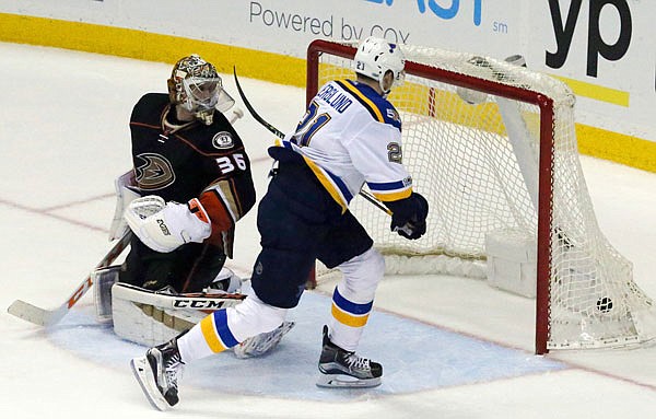 Blues center Patrik Berglund scores the winning goal in overtime past Ducks goalie John Gibson for the 2-1 win in Sunday's game in Anaheim, Calif.