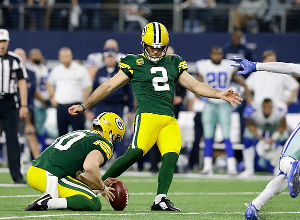 Packers kicker Mason Crosby kicks a 51-yard field goal to win the game as time expires during Sunday's NFL divisional playoff game against the Cowboys in Arlington, Texas. The Packers won 34-31.
