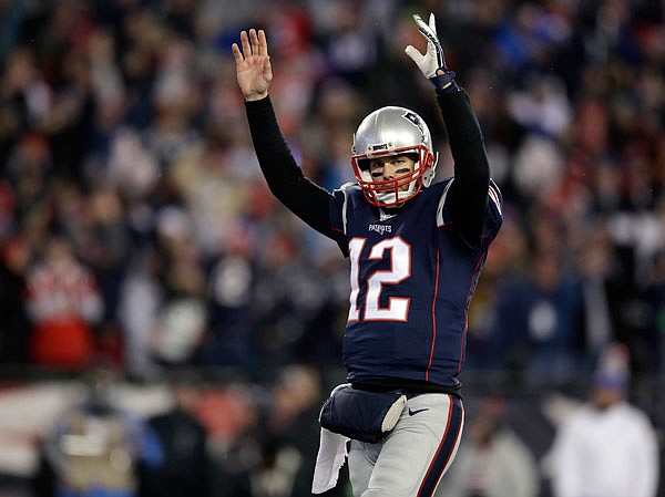 Patriots quarterback Tom Brady celebrates a touchdown by running back Dion Lewis during the second half Saturday's NFL divisional playoff game against the Texans in Foxborough, Mass.