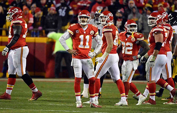 Chiefs quarterback Alex Smith looks up at the video board during the second half of Sunday night's playoff game against the Steelers at Arrowhead Stadium. After four years as a starter, some are questioning Smith's future with the team.