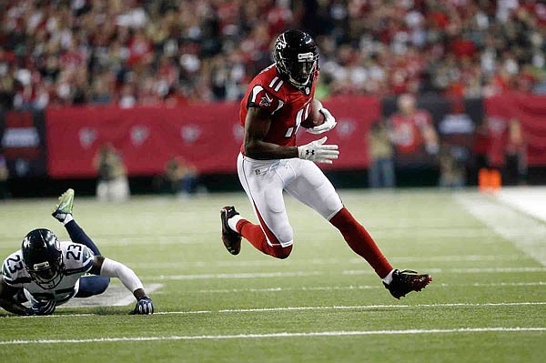 Falcons wide receiver Julio Jones gets away from Seahawks free safety Steven Terrell during Saturday's game in Atlanta.