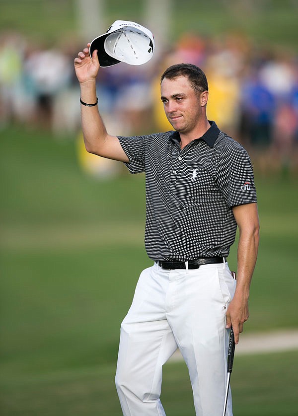 Justin Thomas waves to the gallery after winning the Sony Open on Sunday in Honolulu.