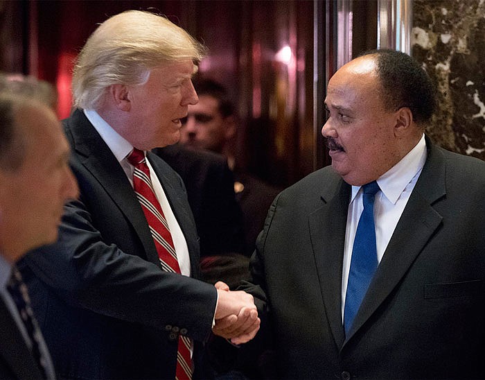 President-elect Donald Trump shakes hands with Martlin Luther King III at Trump Tower in New York on Monday.