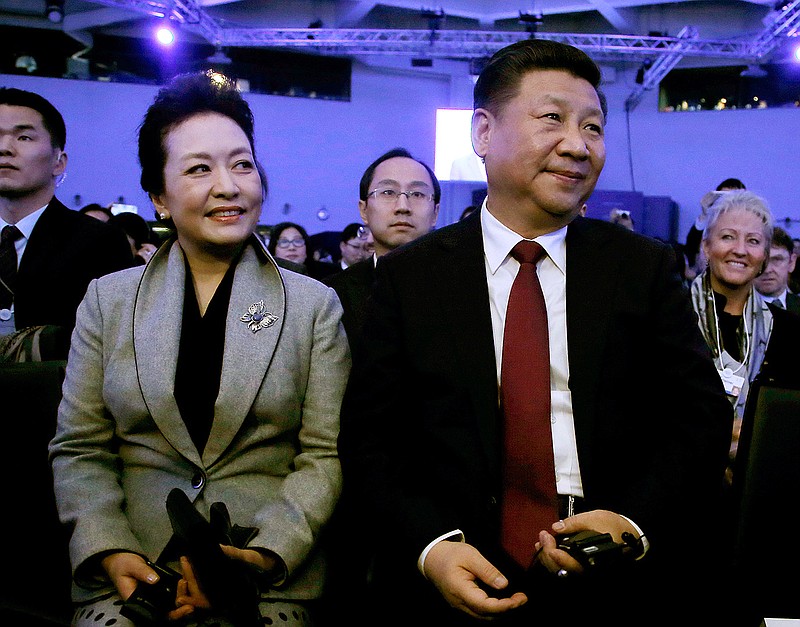 China's President Xi Jinping and his wife Peng Liyuan during the opening session of the World Economic Forum in Davos, Switzerland, Tuesday, Jan. 17, 2017.