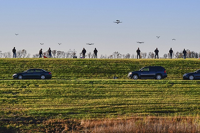 Drone pilots for SkySkopes, a Grand Forks, North Dakota, company that became the first business in the state legally approved by the Federal Aviation Administration to fly unmanned aircraft for business purposes, gather in October 2016 at a practice airfield. With the number of commercial drone operations outpacing the pool of certified drone pilots, experts say more training is needed to help young flyers operate the planes legally and safely.