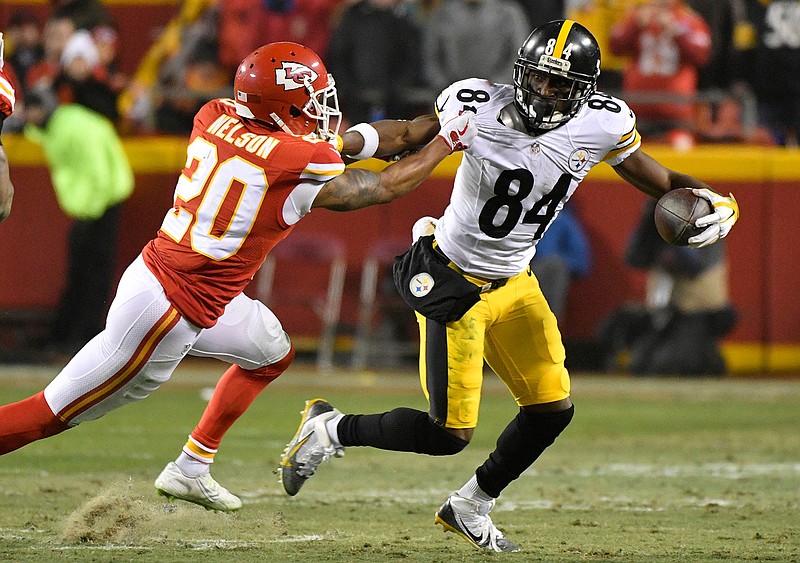 Pittsburgh Steelers wide receiver Antonio Brown (84) breaks a tackle by Kansas City Chiefs cornerback Steven Nelson (20) after making a reception during the first half of an NFL divisional playoff football game Sunday, Jan. 15, 2017, in Kansas City, Mo.