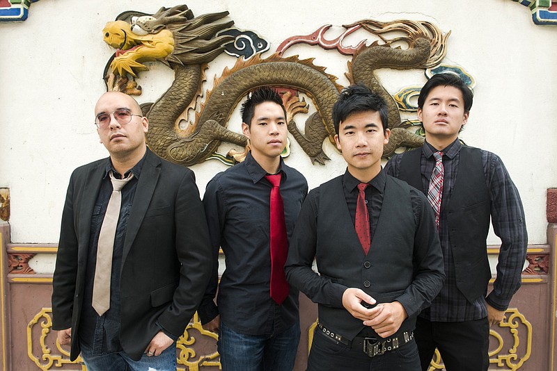 This image provided by Anthony Pidgeon via The Slants, a portrait of Asian-American band The Slantsm, from left, Joe X Jiang, Ken Shima, Tyler Chen, Simon "Young" Tam, Joe X Jiang) in Old Town Chinatown, Portland, Ore., on Aug. 21, 2015.  In a First Amendment clash over a law barring offensive trademarks, the Supreme Court on Jan. 18, 2017, raised doubts about a government program that favors some forms of speech but rejects others that might disparage certain groups. The justices heard arguments in a dispute involving an Asian-American band called the Slants that was denied a trademark because the U.S. Patent and Trademark office said the name is offensive to Asians. 