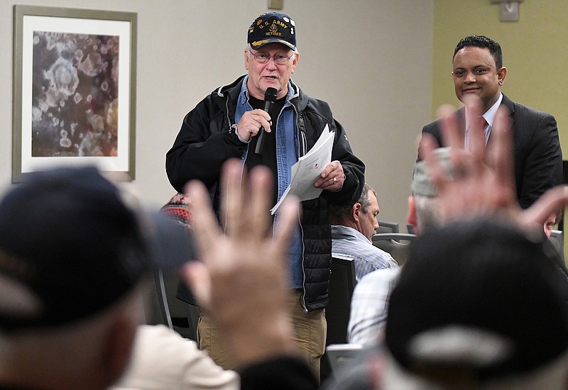 Veterans speak out about their issues and ideas for improvement for the Overton Brooks VA Medical Center in Shreveport, La., during a town hall meeting between hospital staff and area veterans Thursday at the Texarkana, Ark., Convention Center.