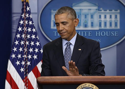 In this Jan. 18, 2017, photo, President Barack Obama taps the podium as he concludes his final presidential news conference in the briefing room of the White House in Washington. Eight tumultuous years at the helm of American power have come and gone, and for Obama, this is finally the end. The president is spending his last full day at the White House on Thursday before becoming an ex-president. 