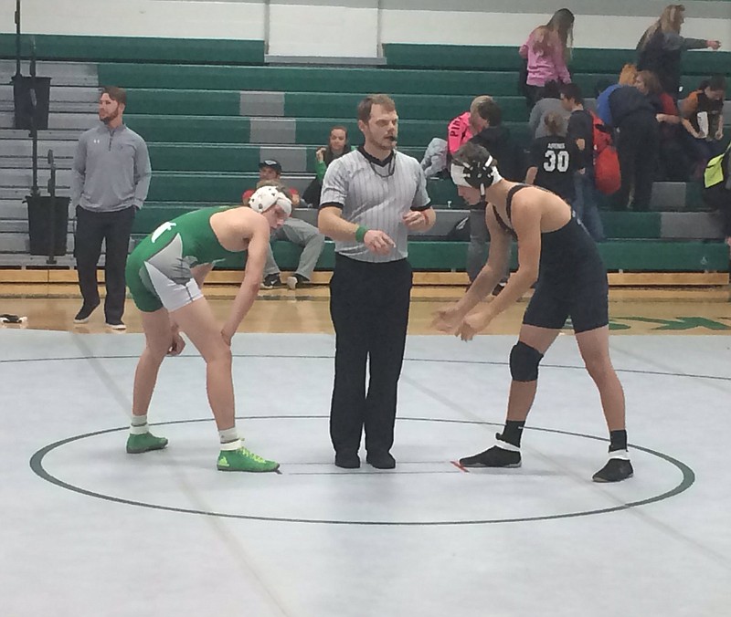 Both Clayton Roling of Blair Oaks and Colby Schwartz of Warsaw sustained small cuts on their heads while wrestling Thursday, Jan. 19, 2017 in Wardsville. Both wrapped the cuts in gauze and returned to the mat.