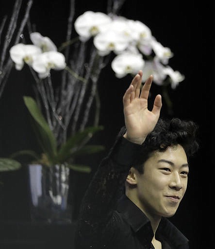 Nathan Chen waves to the crowd after his score was announced in the men's short program at the U.S. Figure Skating Championships on Friday, Jan. 20, 2017, in Kansas City, Mo.