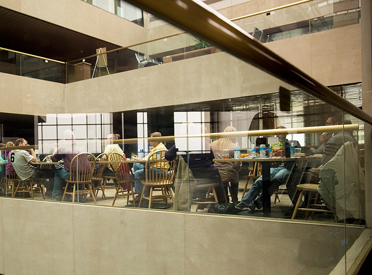 Missouri state workers sit in the Truman Building atrium in this March 8, 2014 file photo.