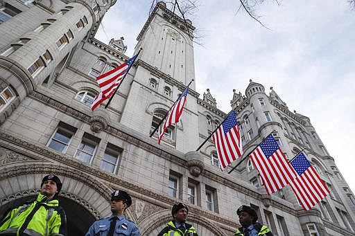 In this Jan. 19, 2017, photo, police stand guard outside the Trump International Hotel on Pennsylvania Avenue in Washington. 