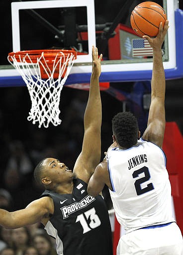 Villanova forward Kris Jenkins (2) takes a shot past Providence forward Kalif Young (13) in the first half of an NCAA college basketball game, Saturday, Jan. 21, 2017, in Philadelphia.