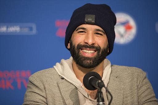 Toronto Blue Jays' Jose Bautista speaks to the media about re-signing with the club during a baseball press conference in Toronto on Saturday, Jan. 21, 2017. 