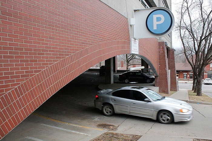 Daytime commuters make their way in and out of a garage on Monroe Street. Permit garages work better for some in Jefferson City due to long work hours.