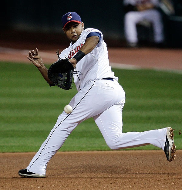 In this Sept. 23, 2009, file photo, Indians first baseman Andy Marte fields a single hit by Tigers' Curtis Granderson in the fourth inning in a game in Cleveland. Marte died in a car accident early Sunday in the Dominican Republic.
