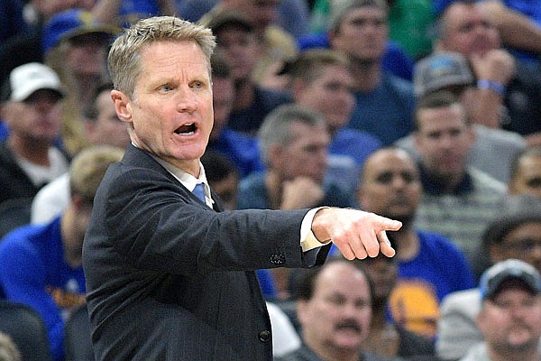 Warriors head coach Steve Kerr calls out instructions during the first half of Sunday's game against the Magic in Orlando, Fla.