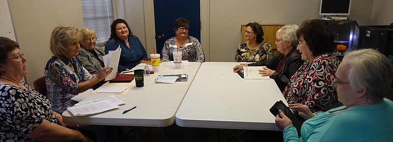  All around the table and ready for discussion are, from left, Charlmaine Ferguson, Becky Collom, Barbara Weems, Jennifer Plum, Jackie Icenhower, Susan Sutton, Jackie Tischhauser, Diana Fulks and Nora Prestinari. Tammie Davidson is also a member.
