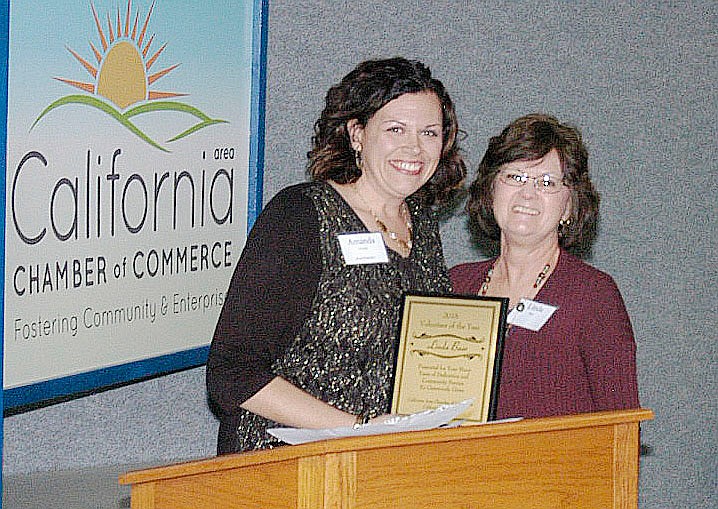 California Area Chamber President Amanda Trimble (left) presents Linda Baer the Volunteer of the Year award.