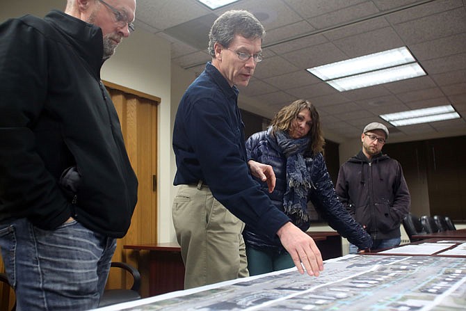 City engineer Dave Bange, second from left, speaks at a public meeting Thursday in City Hall regarding plans for sidewalks and lighting along East Capitol Avenue.