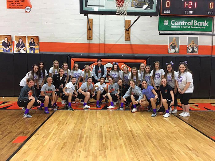 New Bloomfield High School cheerleaders hosted a raffle, and the women's basketball team wore purple socks to raise awareness of Hodgkin's lymphoma, the type of cancer Abby Haas was diagnosed with. Haas is in the second row in the center, wearing a vest.