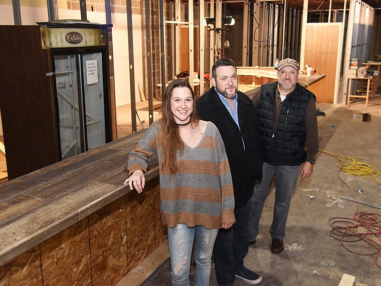 Kara Miller, Wes Wingate and Jerry Wingate pose at the bar of their soon-to-be-opened music venue, The Bridge. It's located in Jefferson City on the lower level of Avenue HQ, 619-621 E. Capitol Ave. Miller is the general manager while the brothers are co-owners of the establishment.
