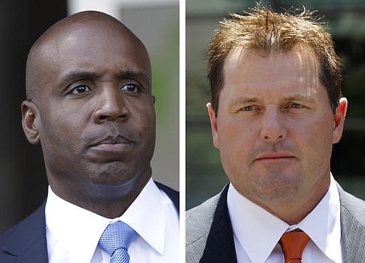 At left, in a June 23, 2011, file photo, former San Francisco Giants baseball player Barry Bonds leaves federal court in San Francisco. At right, in a July 14, 2011 file photo, former Major League baseball pitcher Roger Clemens leaves federal court in Washington. 