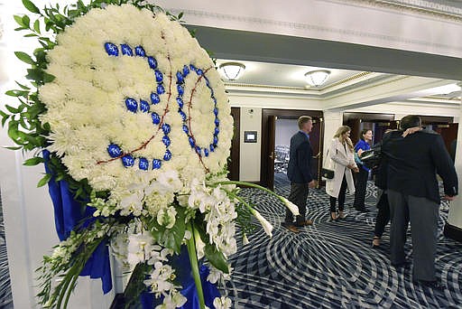 A wreath stands outside a room where Kansas City Royals' Yordano Ventura was remembered by members and employees of the baseball team in Kansas City, Mo. Ventura died in a car crash in the Dominican Republic. (John Sleezer/The Kansas City Star via AP)