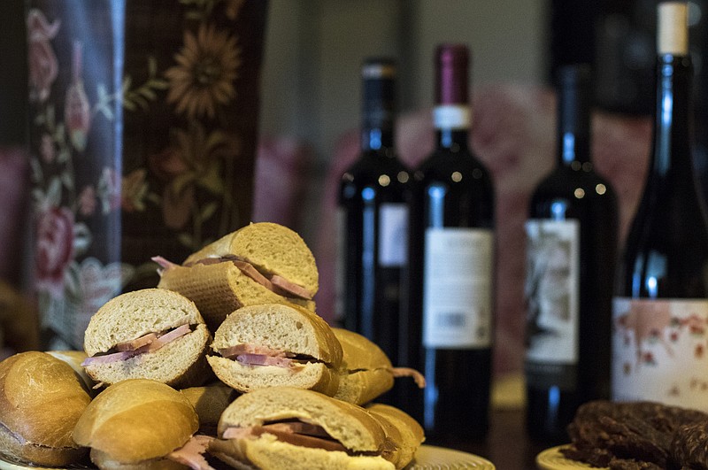 Wine, ham sandwiches and salad are served for lunch at Jack Matusek family's ranch in Yoakum, Texas, on Jan. 17, 2017. 