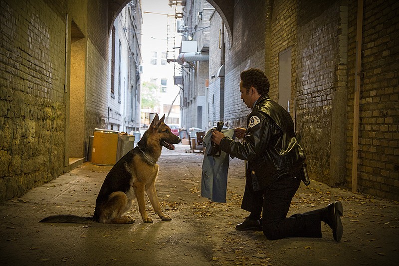 This image released by Universal Studios shows John Ortiz in a scene from "A Dog's Purpose." 