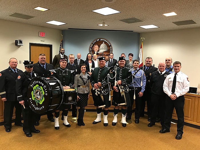 The Jefferson City Fire Department Pipes and Band are honored with the city's Outstanding Employee Service Award.