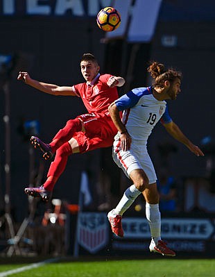 Graham Zusi of the United States (right) fights for the ball with Serbia's Srdan Plavsic during Sunday's match in San Diego.