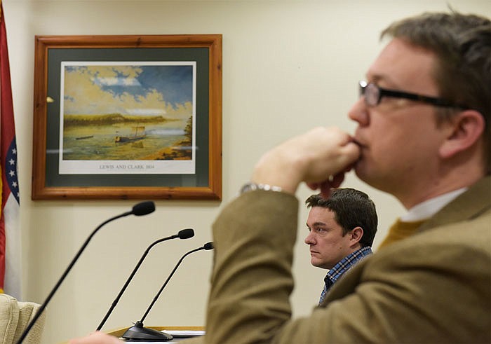 Eric Baron, a senior partner on the planning department, contemplates the statements that he is recieving during a meeting about the East Capitol urban renewal at the Jefferson City Municipal Court on Monday.
