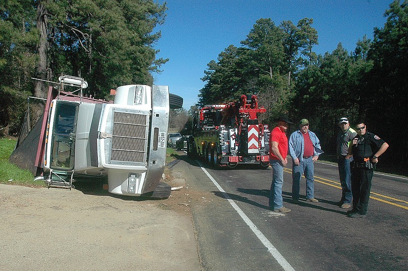 A tractor-trailer dump truck overturned about 10 a.m. Tuesday on Kings Highway in Nash, Texas, near the Dixie Diner. The truck was driven by Kenneth Wren of Texarkana, Texas, and was southbound when a car was attempting to turn in front of the truck. The truck, loaded with dirt, swerved to miss the car and overturned in a ditch. No one was hurt, according to a report by Texarkana, Texas,  Officer Dacota Taylor.