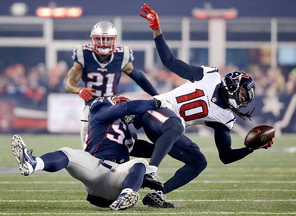 In this Jan. 14 file photo, Patriots linebacker Dont'a Hightower (54) tackles Texans wide receiver DeAndre Hopkins (10) during the first half of a playoff game in Foxborough, Mass. 