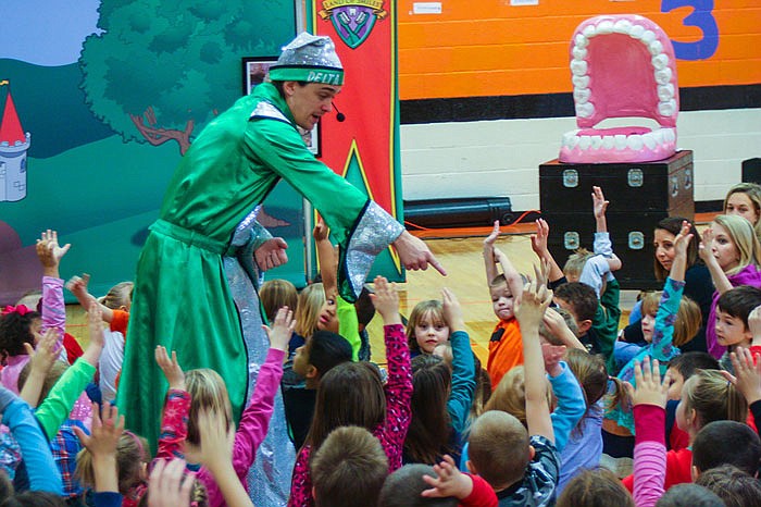 The 'Tooth Wizard' picks a volunteer from the crowd at New Bloomfield Elementary. Every year, Delta Dental's Land of Smiles program teaches kids around the state about dental hygiene through an interactive performance at their school.