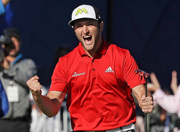 Jon Rahm reacts after making a putt for eagle on the 18th hole Sunday during the Farmers Insurance Open at Torrey Pines Golf Course in San Diego.