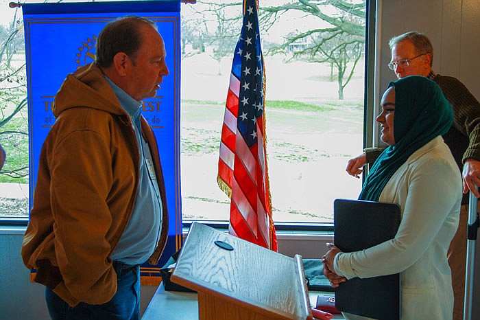 A Fulton Rotary Club member takes a minute to chat with Humera Lodhi (right) after Wednesdays meeting. Lodhi gave the members of the club an overview of her Islamic faith.