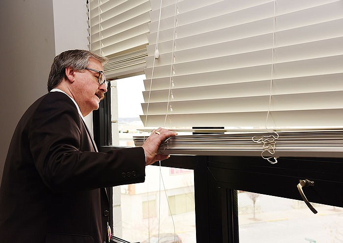 In this Feburary 2, 2017 photo, Cole County Presiding Commissioner Sam Bushman inspects new windows at the courthouse.