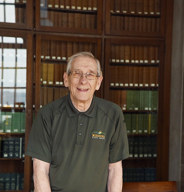 Longtime Missouri Capitol tour guide Henry Gensky poses in the first floor rotunda and legislative library.