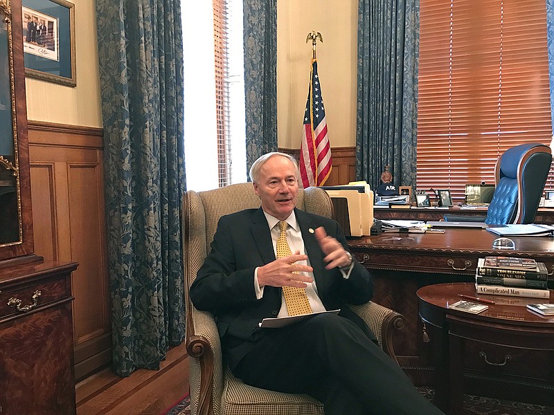 Arkansas Gov. Asa Hutchinson speaks to reporters in his office about the state's finances on Thursday, Feb. 2, 2017 in Little Rock, Ark. The Republican governor said he's asked several agencies to come up with contingency plans for potential budget cuts after finance officials said the state's revenue dropped $57 million below forecast.