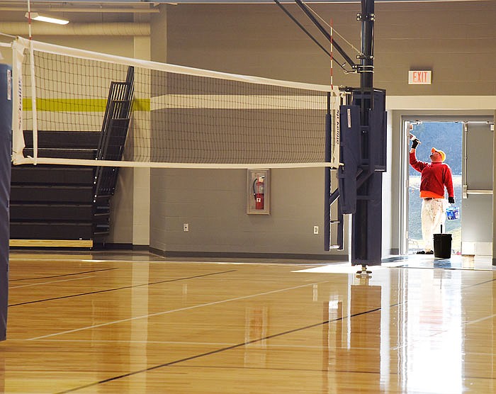 Chuck Sutton applies a final coat of paint to an exterior door to the gymnasium of the new Wellness Center. Several different sub-contractors are working to complete the large project in time for the upcoming open house and grand opening. Parks and Recreation Department staff will soon start moving their offices from downtown to this location.